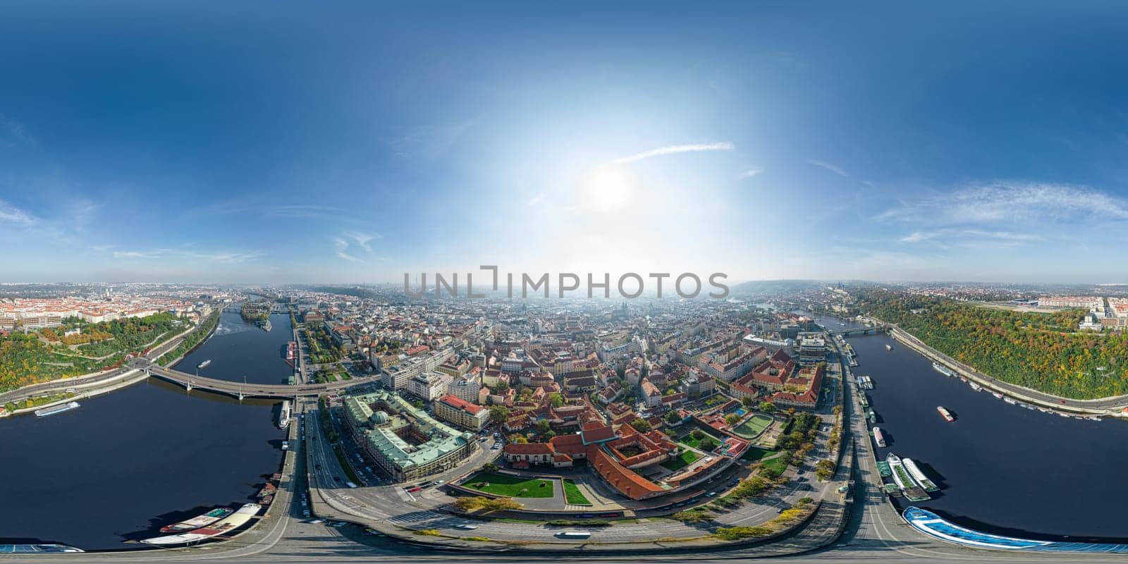 Aerial Prague panoramic drone view of the city of Prague at the Old Town Square, Czechia. Prague Old Town pier architecture and Charles Bridge over Vltava river in Prague at sunset, Czech Republic.