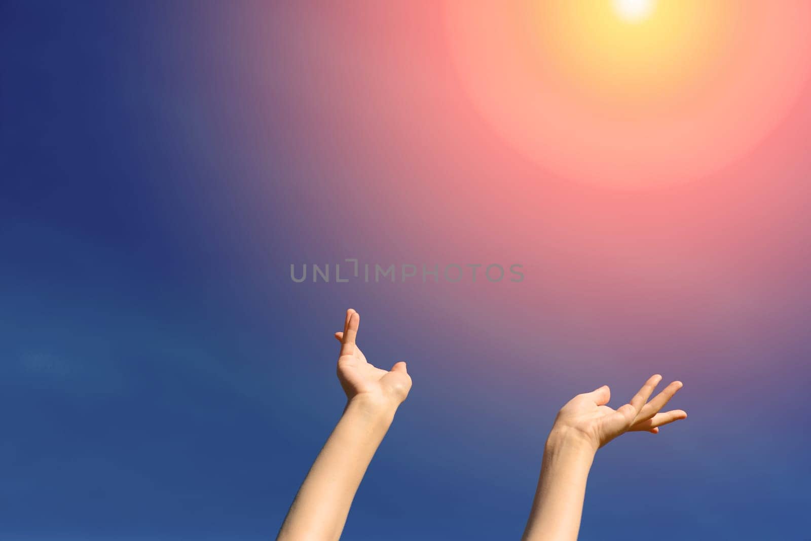 I wish we could touch the sky, female stretching hands to blue sky. Freedom and spring concept