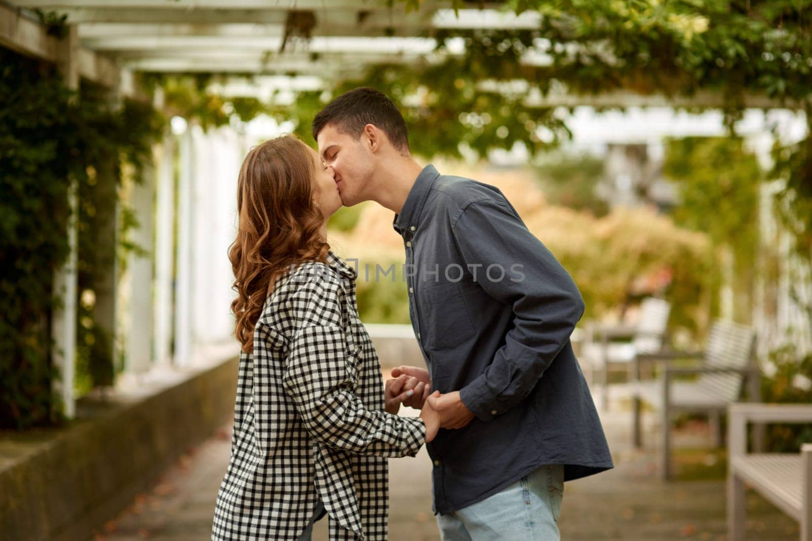 Warm Embrace of Teen Love in the Autumn Park. Capturing Teen Moments: Love Blossoms in Autumn's Embrace. Teenagers in Love: Embracing the Autumn Vibe by Andrii_Ko