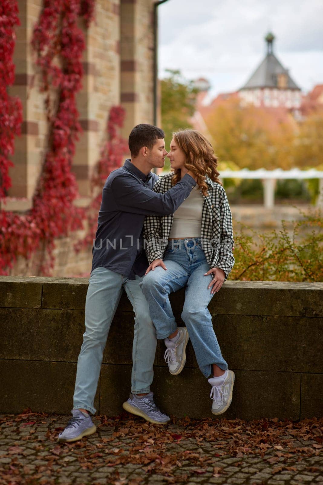 Young Cute Female Hugs Boyfriend. In Autumn Outdoor. Lovers Walking in Park. Attractive Funny Couple. Lovestory in Forest. Man and Woman. Cute Lovers in the Park. Family Concept. Happy Couple.