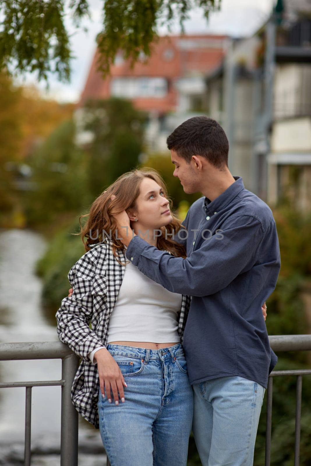 Young Cute Female Hugs Boyfriend. In Autumn Outdoor. Lovers Walking in Park. Attractive Funny Couple. Lovestory in Forest. Man and Woman. Cute Lovers in the Park. Family Concept. Happy Couple.