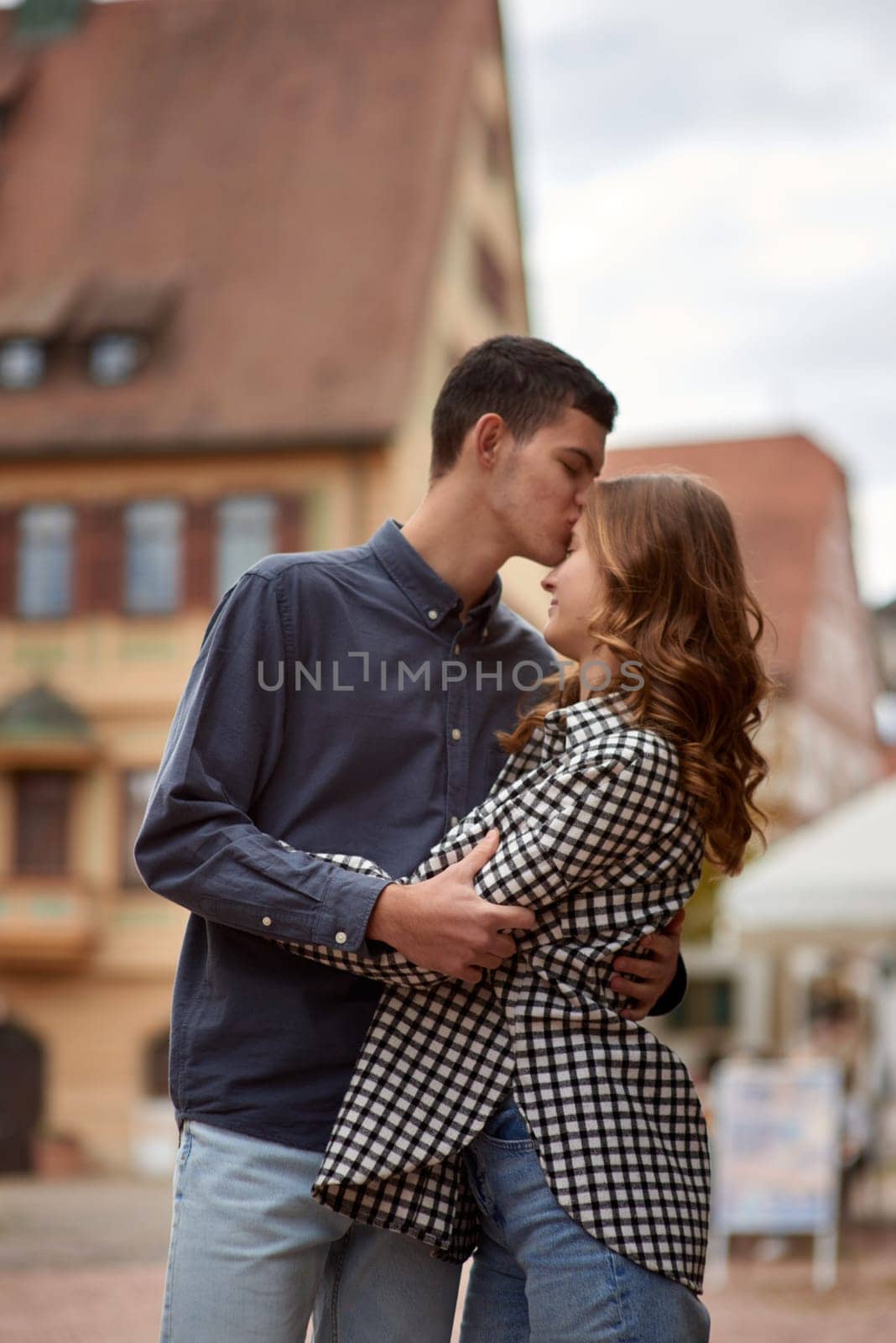 Young Cute Female Hugs Boyfriend. In Autumn Outdoor. Lovers Walking in Park. Attractive Funny Couple. Lovestory in Forest. Man and Woman. Cute Lovers in the Park. Family Concept. Happy Couple.