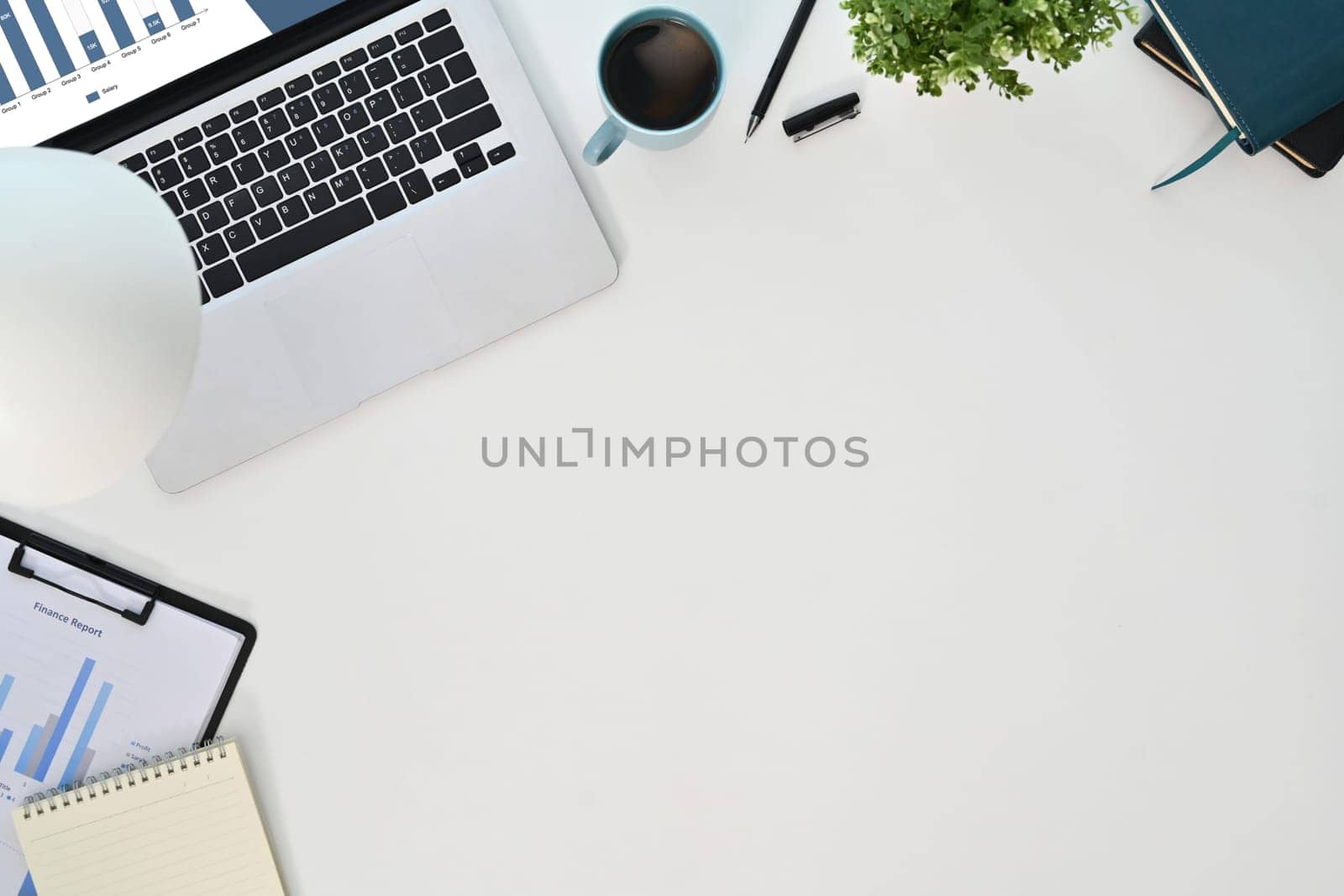 Top view laptop computer, coffee cup, document and coffee cup on white background.