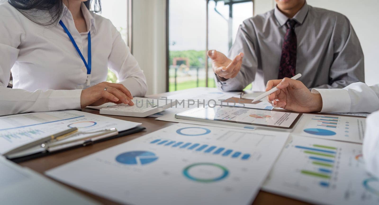 Business team employee adviser meeting to analysis and discuss the situation on the financial report in the meeting room. Investment Consultant, Financial advisor and accounting concept.