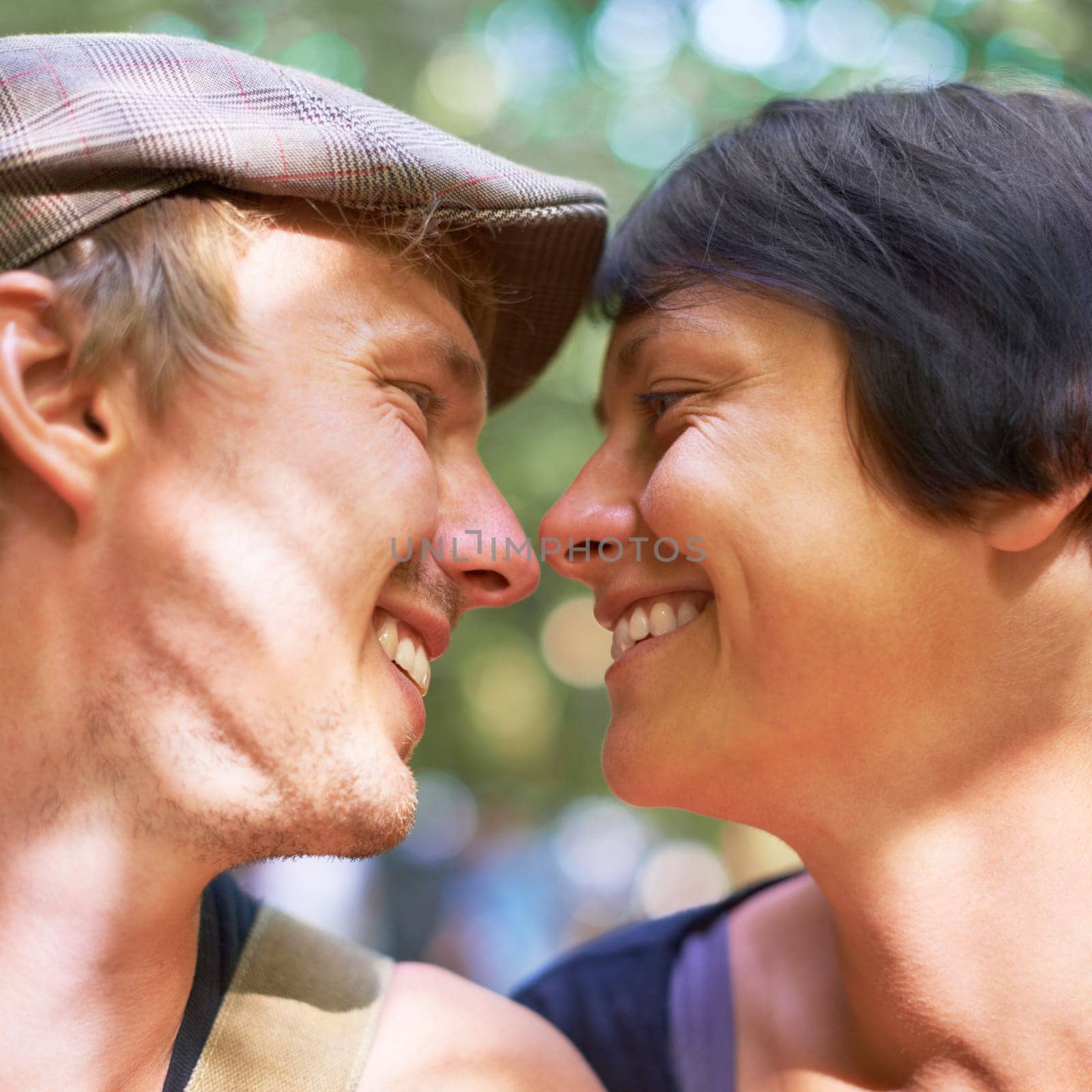 Smile, love and face profile of couple together outdoor, healthy relationship and connection in nature. Happy man, woman and romantic people looking at each other, bonding and support, kiss and date.