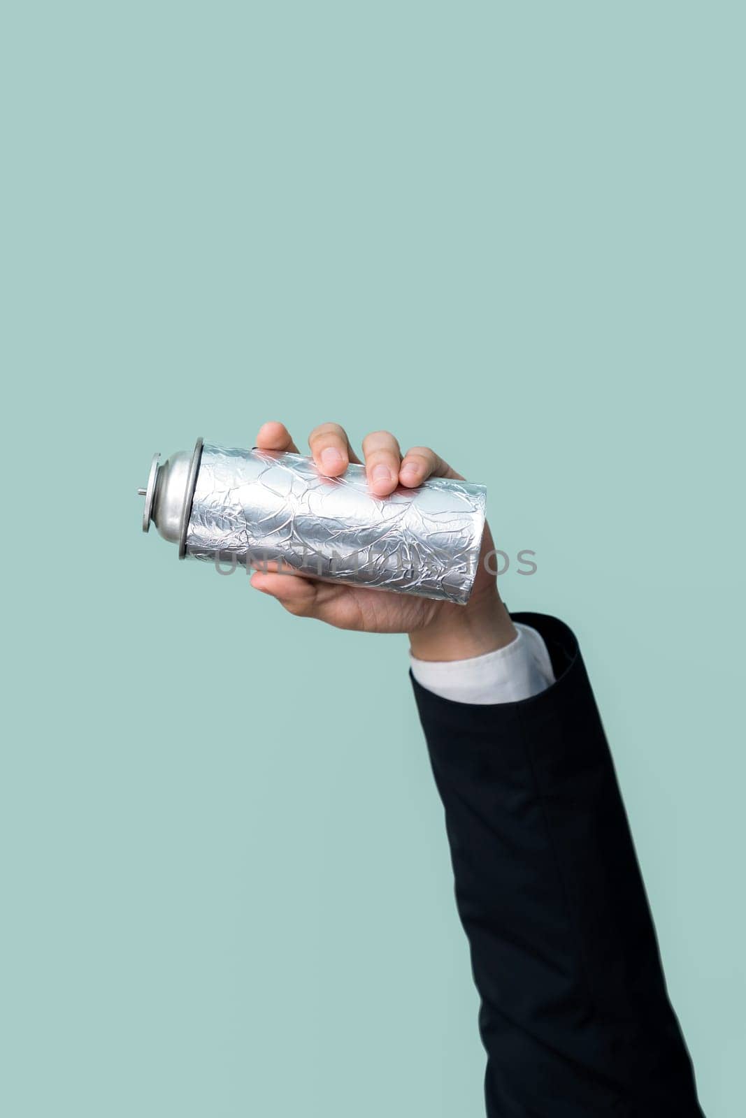 Businessman's hand holding spray can on isolated background. Eco-business recycle waste policy in corporate responsibility. Reuse, reduce and recycle for sustainability environment. Quaint