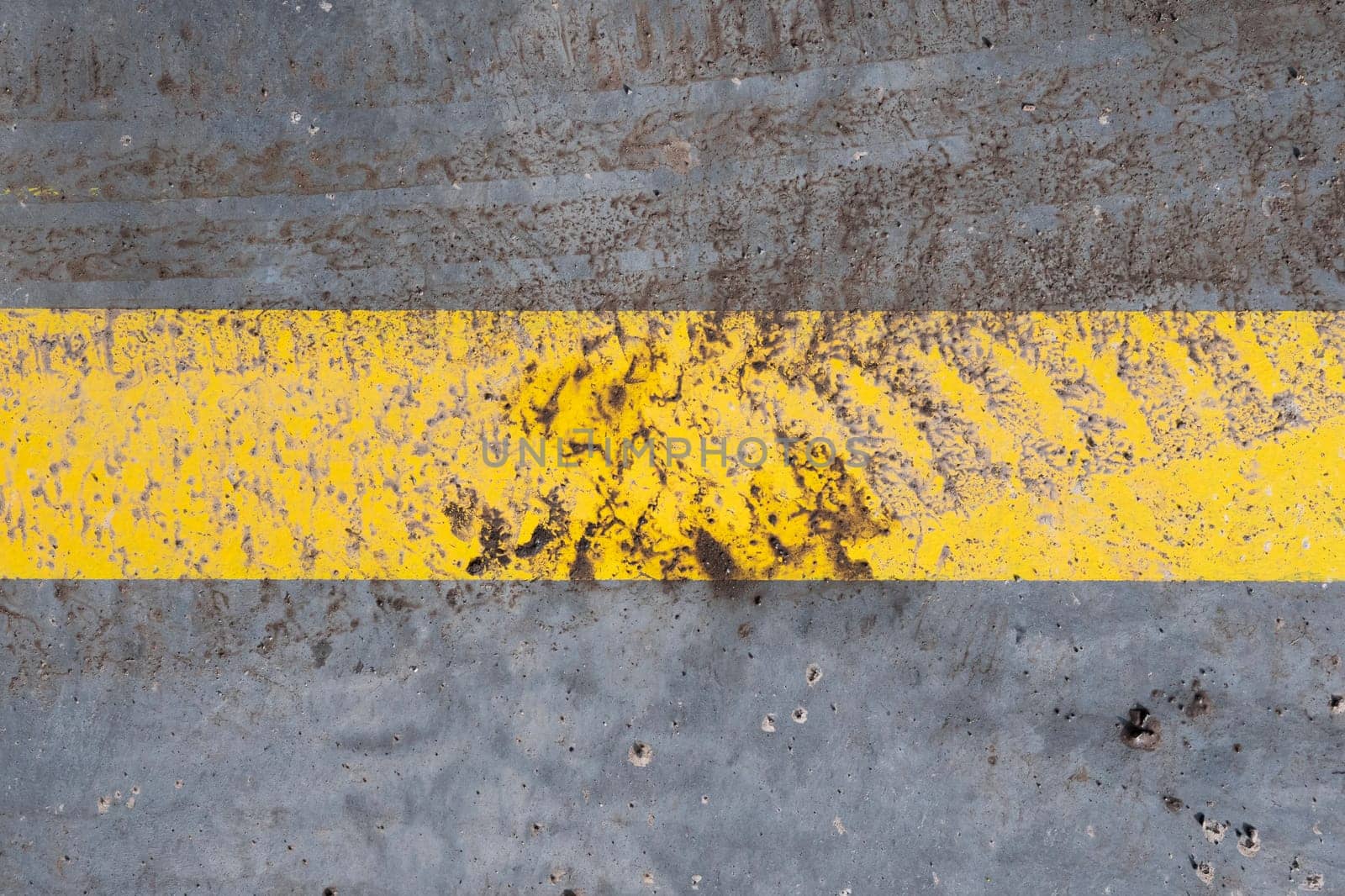 tire print on a single yellow line.