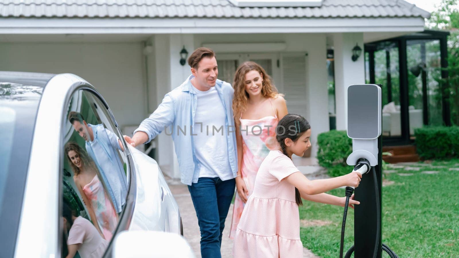Electric vehicle and modern family at home concept. Synchronos by biancoblue
