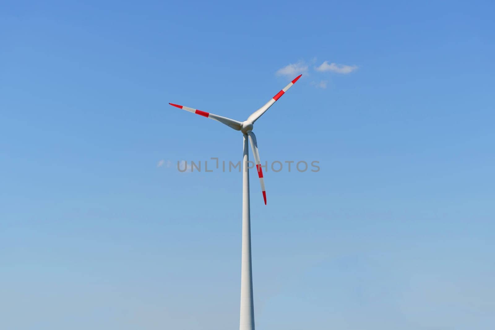 Wind turbine for power generation outdoors with sun and blue sky. by Sd28DimoN_1976