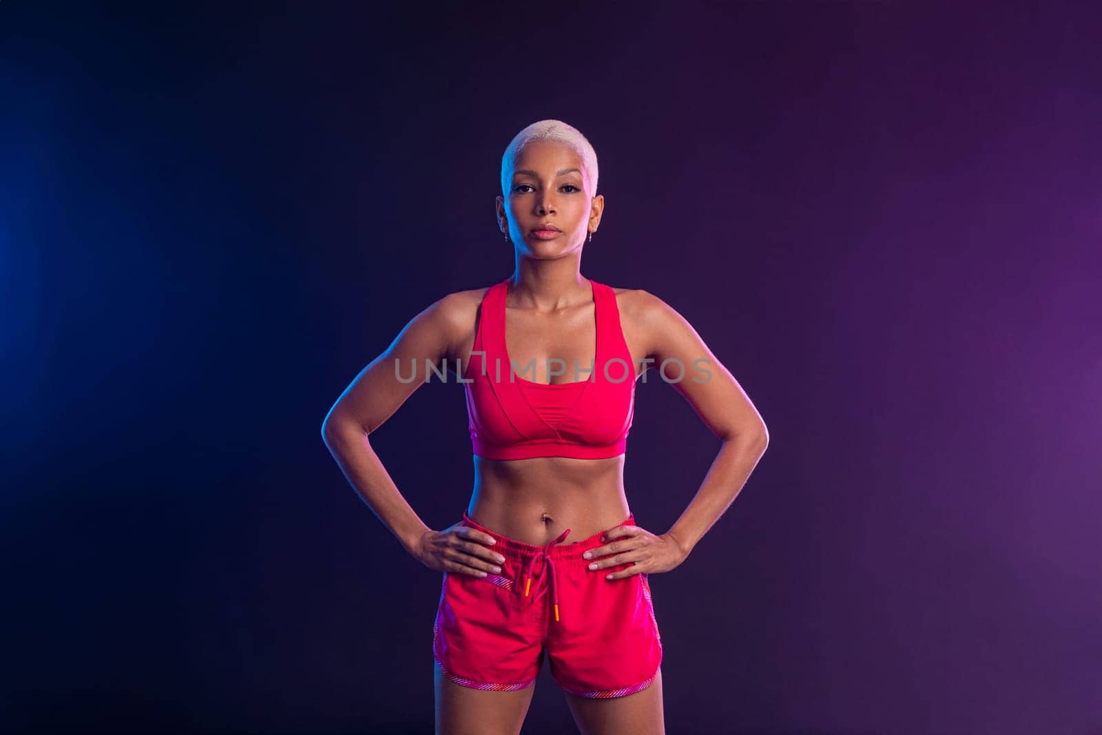 Sporty fit woman, athlete make fitness exercises on neon background. Download cover for music collection for fitness classes. Sports recreation. Beautiful black young woman. by MikeOrlov