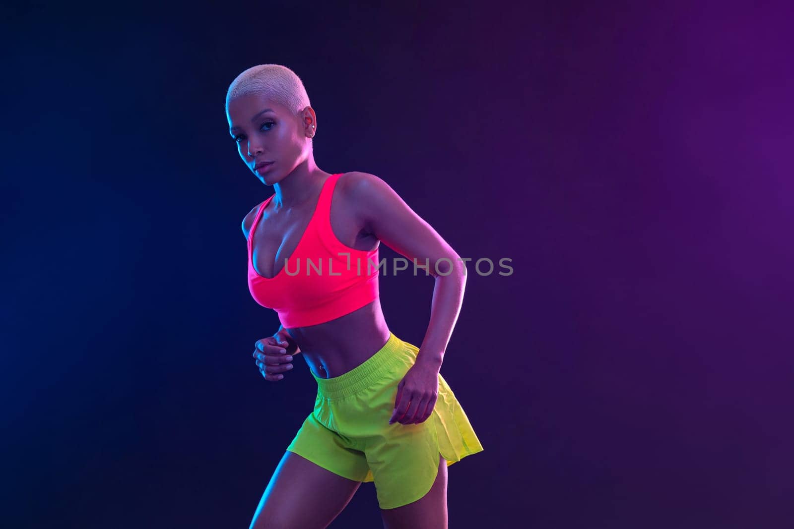 Sporty fit woman, athlete with dumbbells make fitness exercises on black background. Download cover for music collection for fitness classes. Sports recreation. Beautiful black young woman