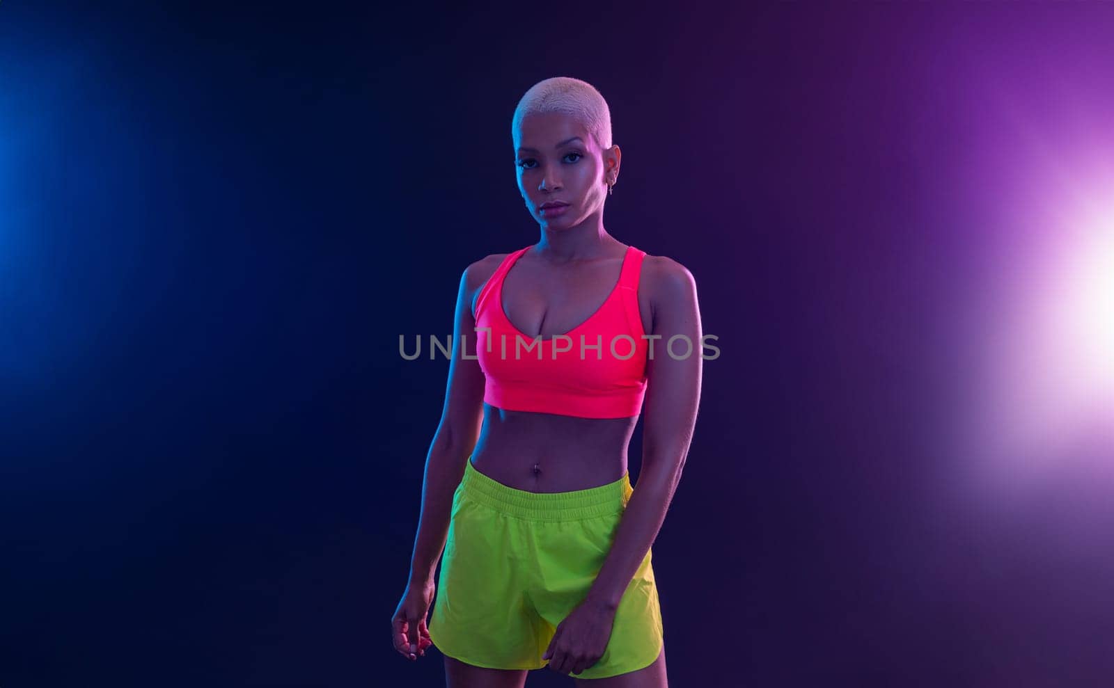 Sporty fit woman, athlete with dumbbells make fitness exercises on black background. Download cover for music collection for fitness classes. Sports recreation. Beautiful black young woman.