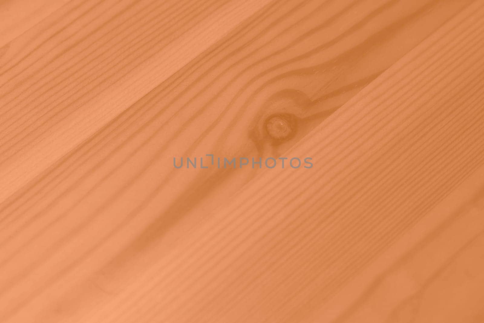 Peach Fuzz color wood texture monochrome background. Wood texture with natural pattern. Color of the year 2024. High quality photo