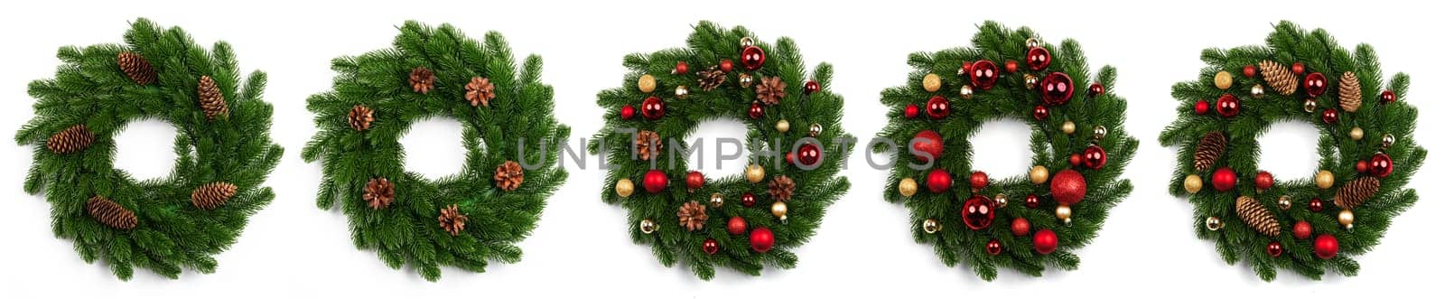 isolated christmas wreath and red gold balls on white background