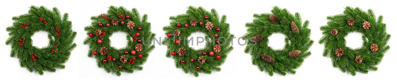 isolated christmas wreath and red balls on white background