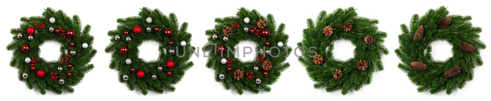 isolated christmas wreath and red silver balls on white background