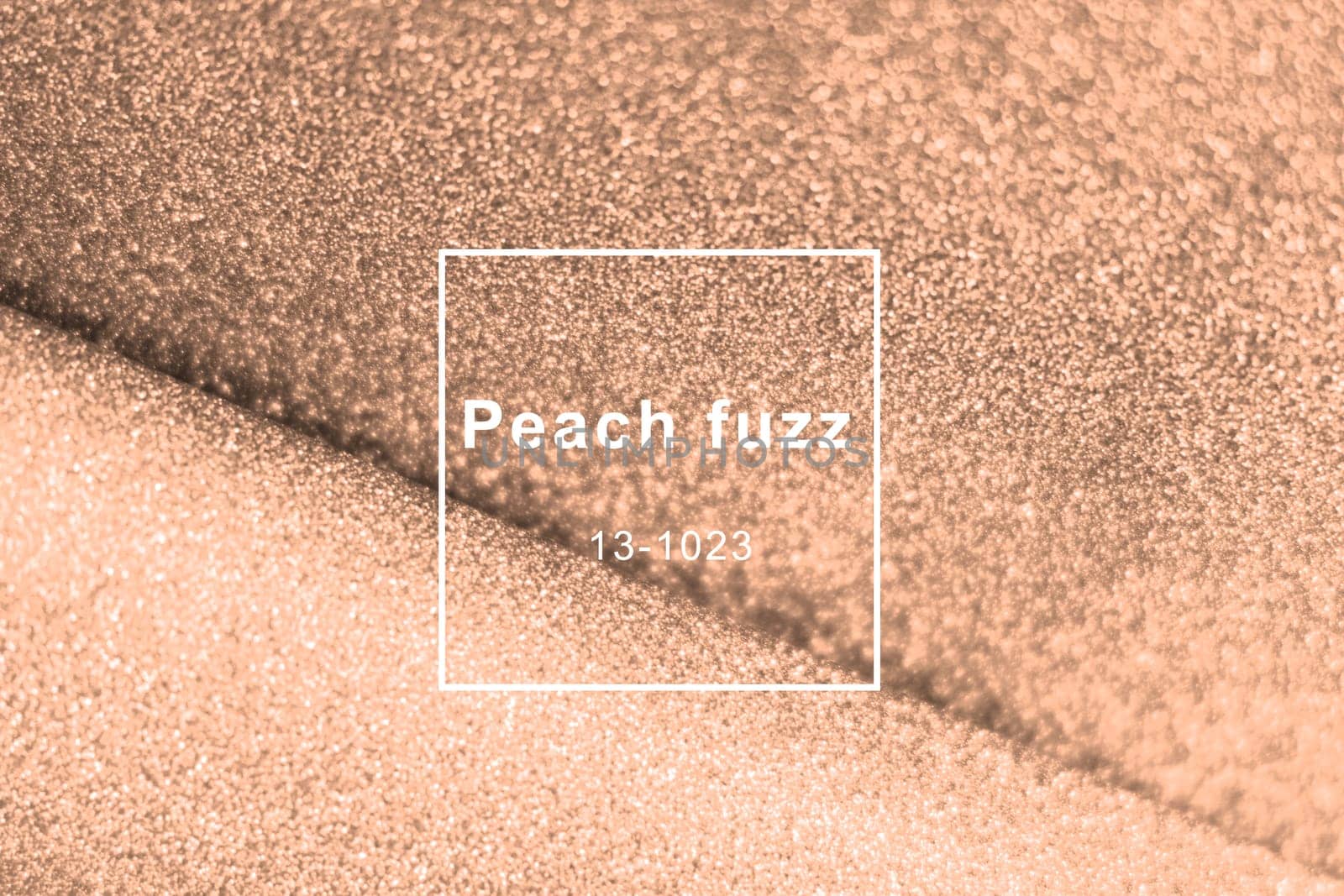 Peach fuzz, color of the year wave shiny glitter paper texture. Shining luxurious fabric. Glimmering golden color, christmas background.
