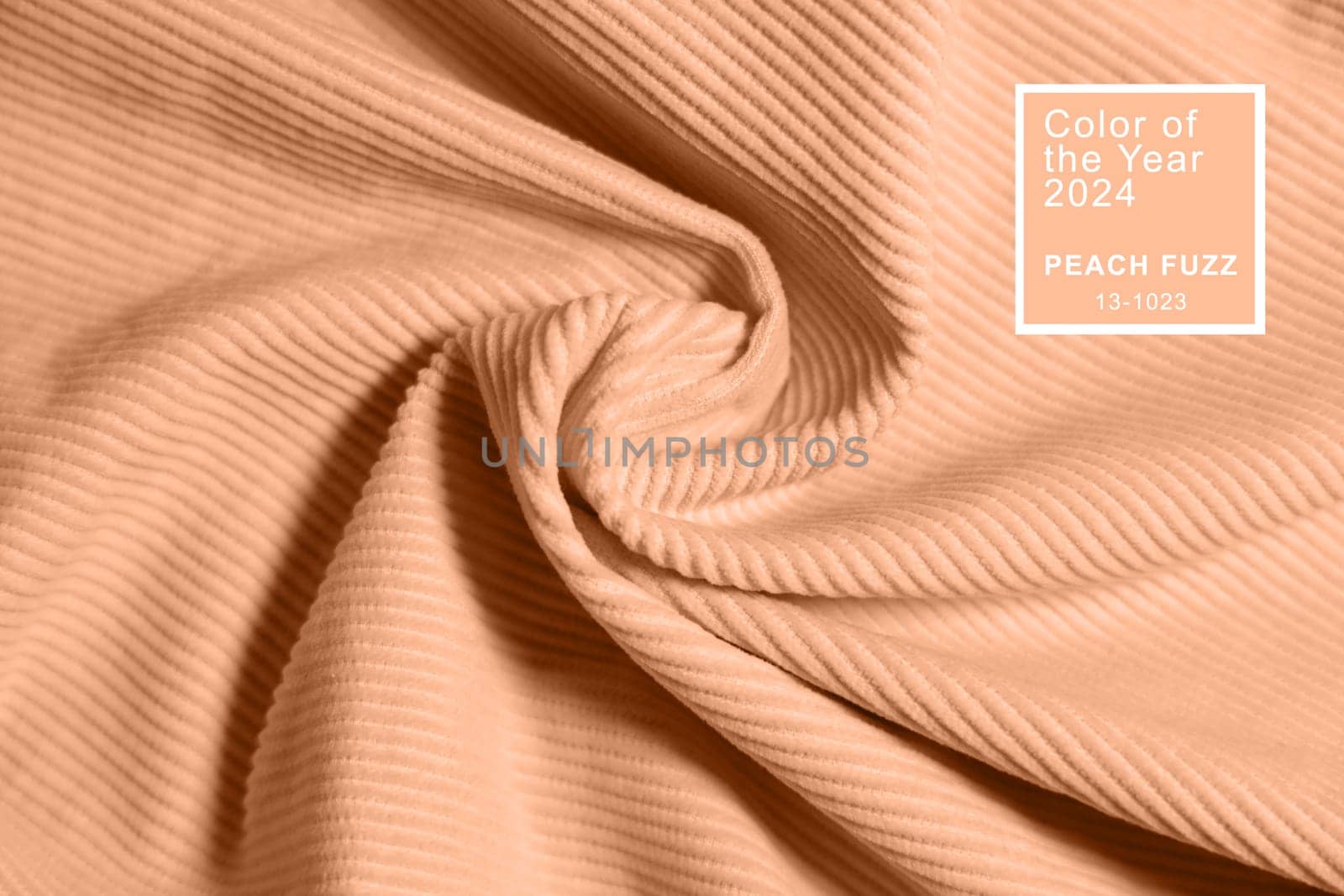 Peach fuzz, color of the year 2024, velvety fabric texture. Texture of velvet textile toned on peach fuzz color. by Ri6ka