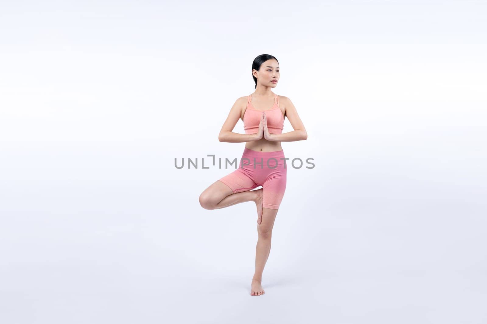 Asian woman in sportswear doing yoga exercise posing. Vigorous by biancoblue