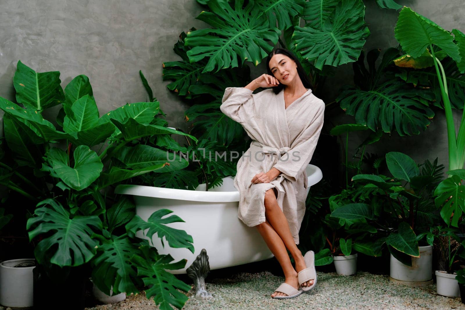 Tropical and exotic spa garden with bathtub in modern hotel or resort. Blithe by biancoblue