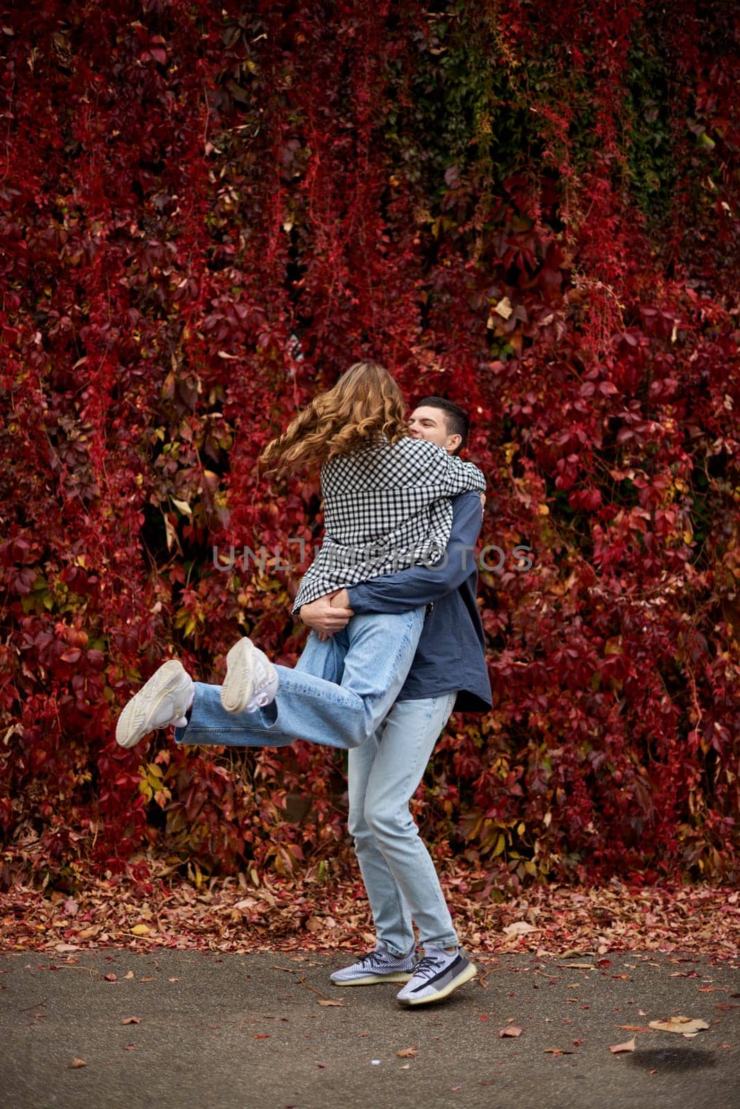 Warm Embrace of Teen Love in the Autumn Park. Capturing Teen Moments: Love Blossoms in Autumn's Embrace. Teenagers in Love: Embracing the Autumn Vibe by Andrii_Ko