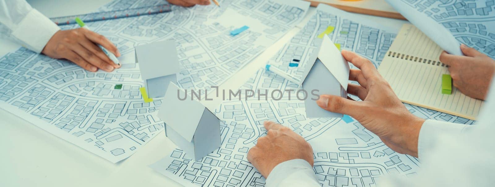 Worker, architect and engineer work on real estate construction project oratory planning with cartography and cadastral map of urban town area to guide to construction developer business plan of city