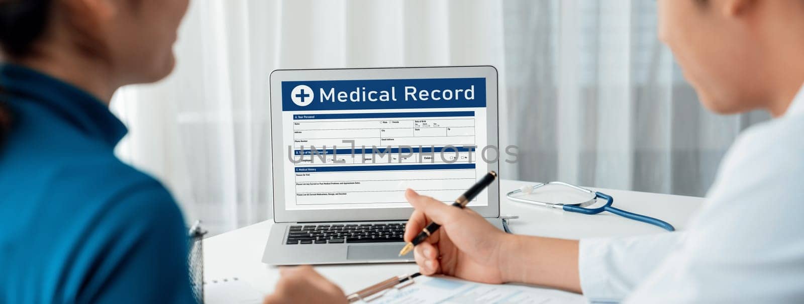 Focused laptop display medical report or diagnostic result of patient health on blurred background of doctor's appointment in hospital. Medical consultation and healthcare treatment. Panorama Rigid