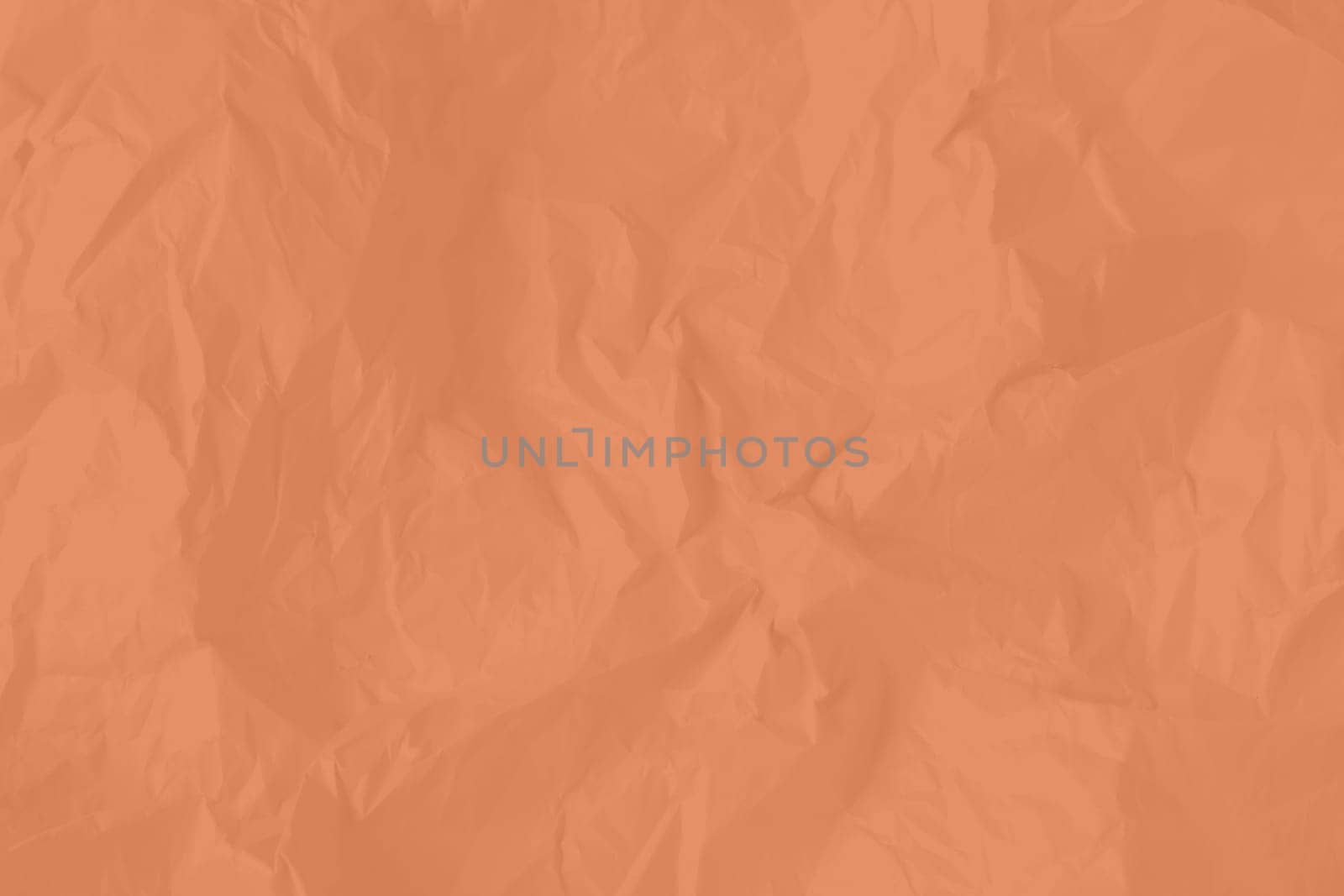 Crumpled paper Peach Fuzz color of the year 2024. Texture crumpled paper for your design. Copy space. High quality photo