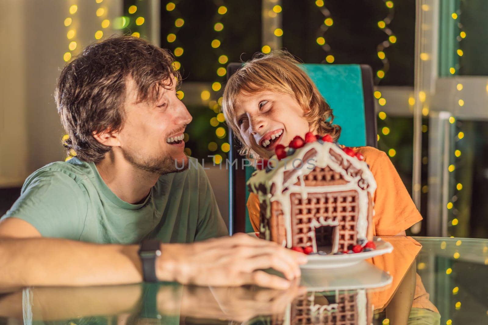 Savor unique moments as dad and son bite into an unconventional gingerbread house, adding a twist to Christmas traditions. A tasty blend of creativity and family joy.