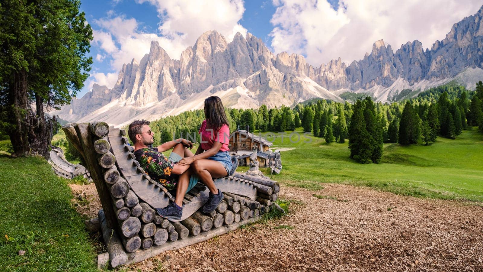 Couple at Geisler Alm, Dolomites Italy, hiking in the mountains of Val Di Funes in Italian Dolomites by fokkebok