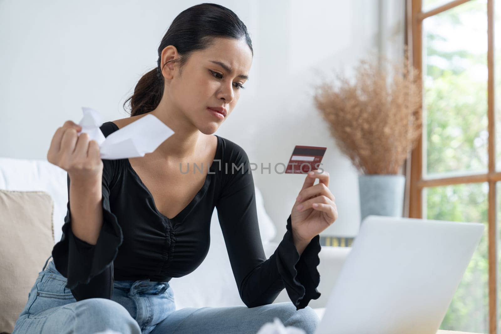 Stressed young woman has financial problems credit card debt to pay uttermost by biancoblue