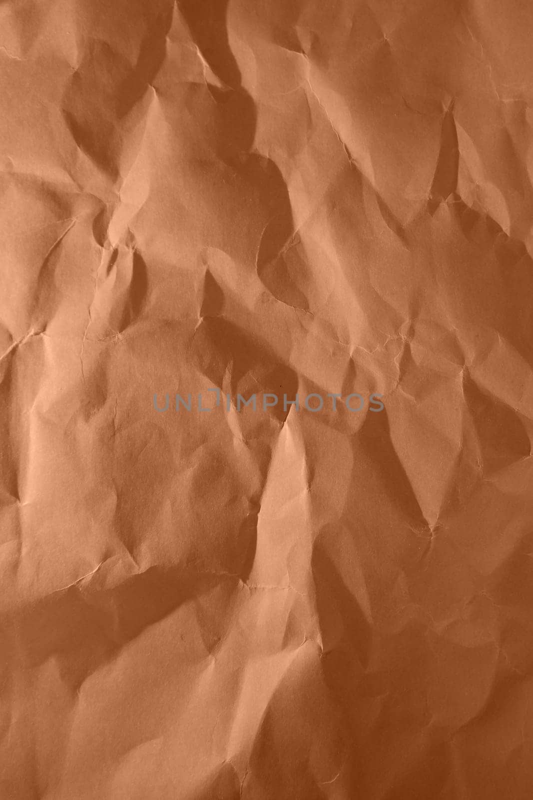 Peach fuzz, color of the year 2024, shining luxurious fabric. Wrinkled paper texture. Copy space for text. by Ri6ka
