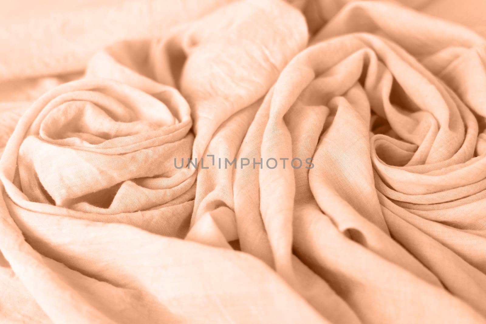 Peach fuzz, color of the year 2024, cotton fabric texture background, textile pattern, copy space.
