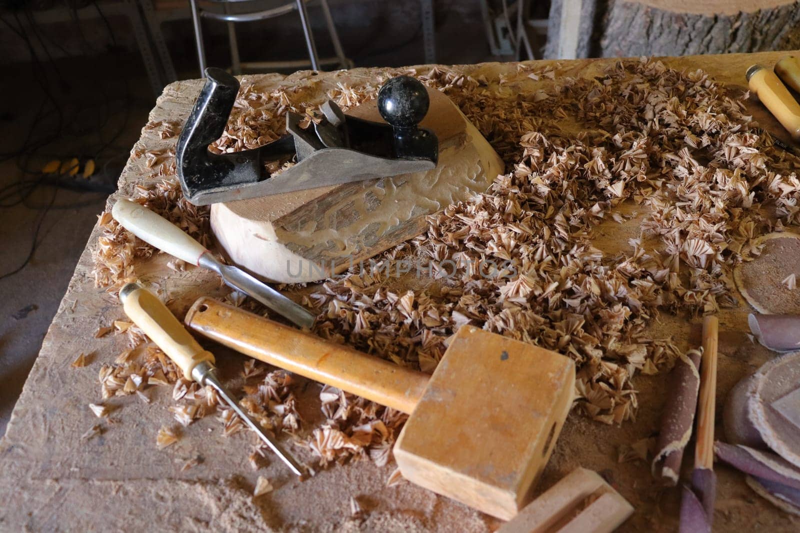 Hand tool on the background of the carpentry workshop. by AleksBay