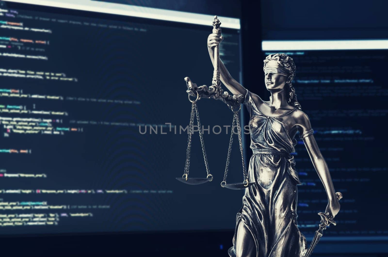 Justice statue with code on screen in background by simpson33