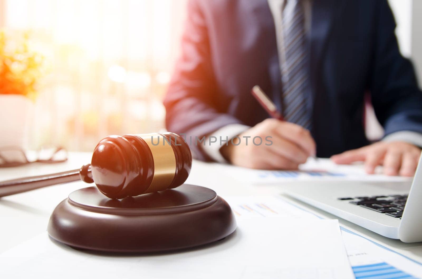 Wooden gavel on table. Attorney working in courtroom. by simpson33