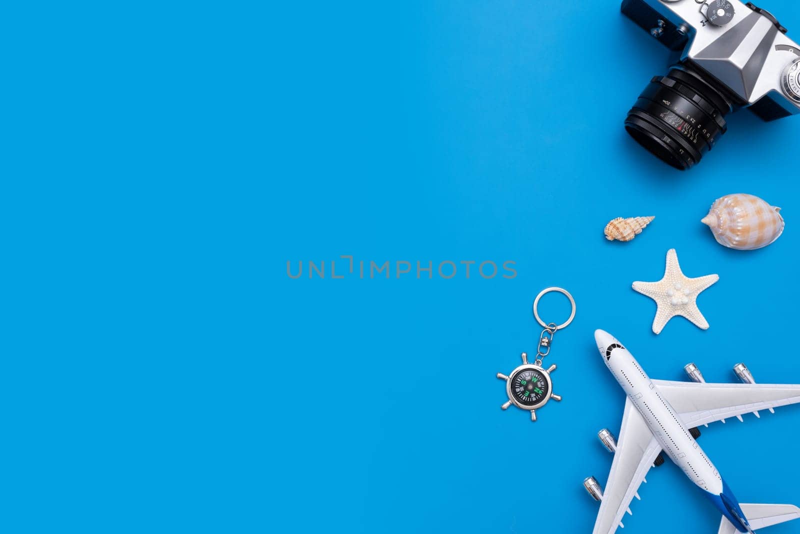 Summer Travel accessories on blue background. Travel planning top view concept