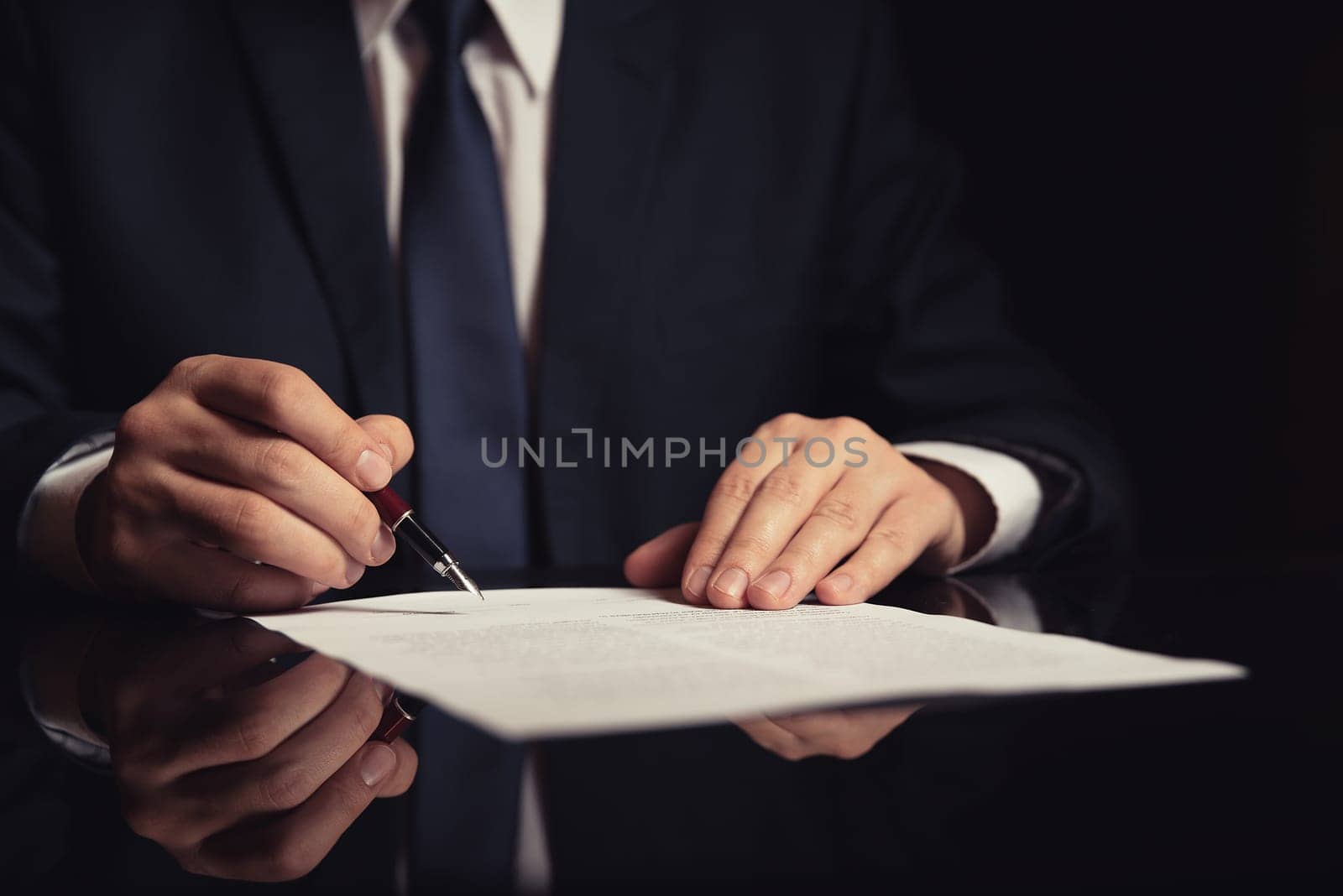 Notary working in office. Lawyer, attorney, business person signing a contract, working in office