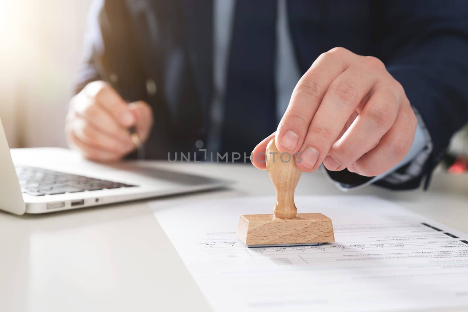 Businessman stamps the documents. Concept of contract, consent, clerk working in the office