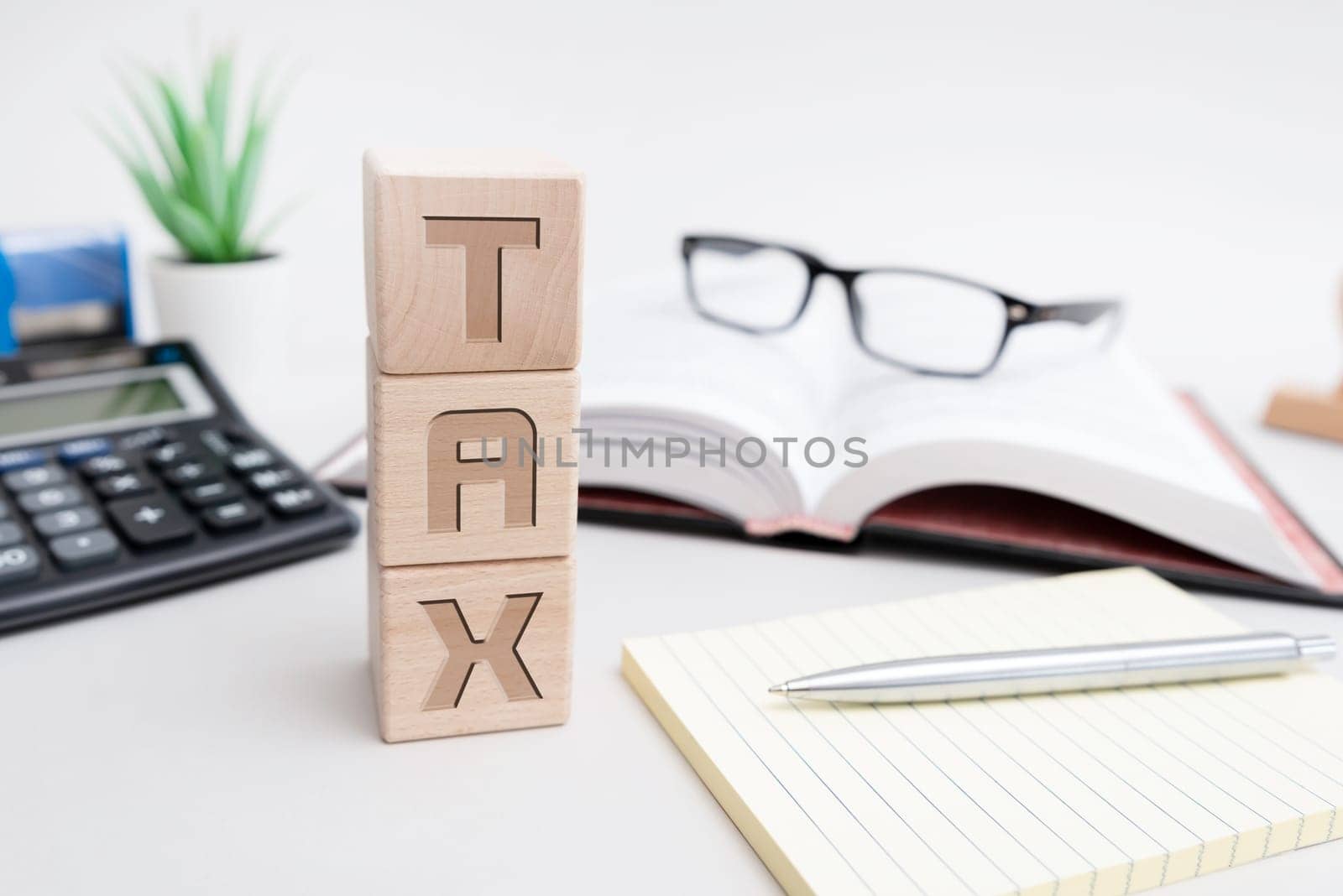 Budget, finance and tax concept with wooden blocks