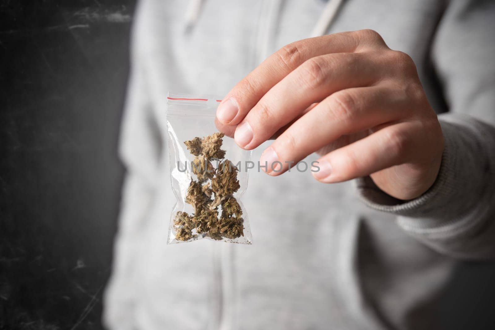 Drug package with hemp. Man with marijuana bag by simpson33