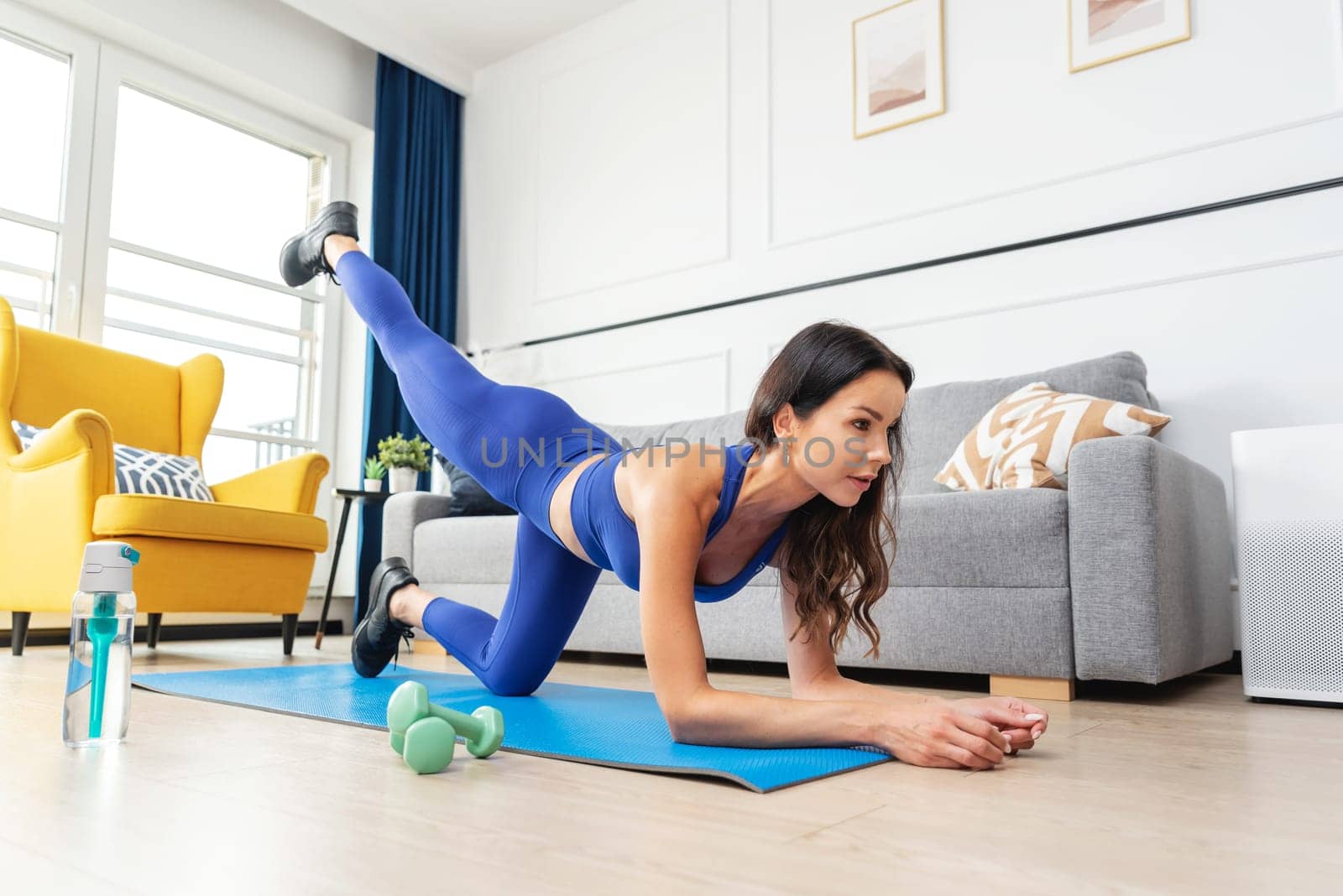 Woman exercising. Workout at home, home fitness by simpson33