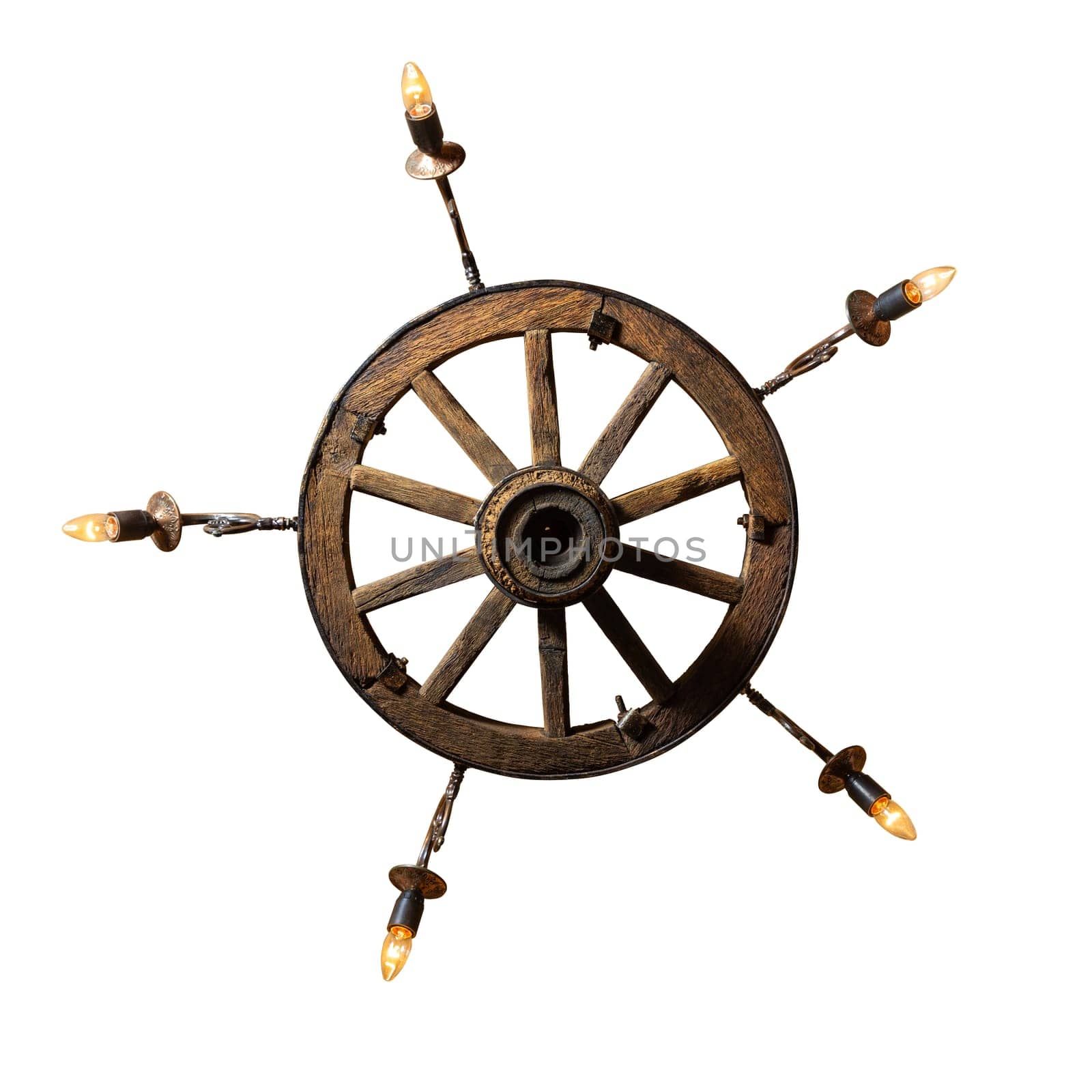 Decorative chandelier from a trolley wheel with chains and with concealed wiring. Rustic chandelier made from wood wagon wheel isolated on white. Bottom view.