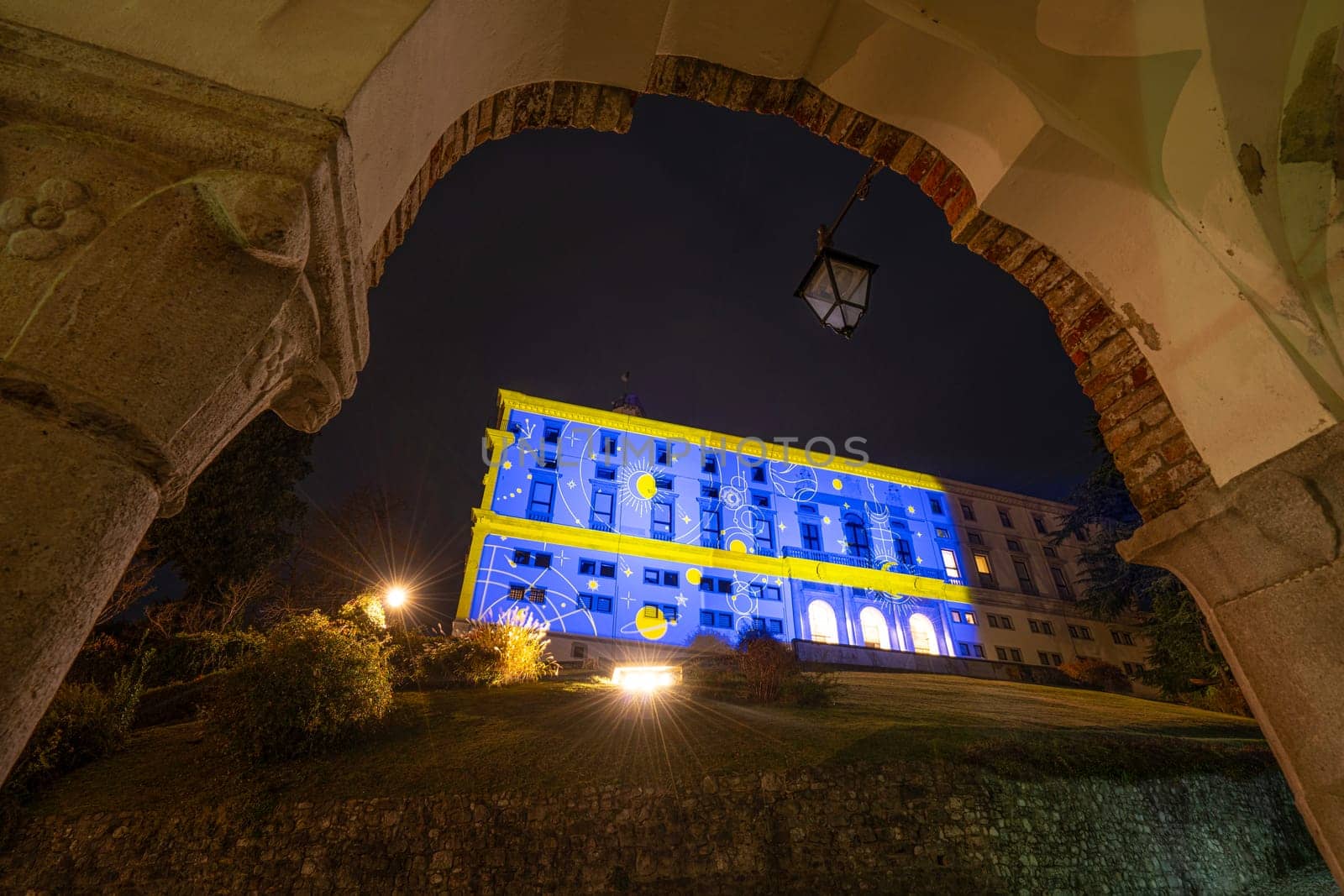 Udine, Italy, December 2023. the Christmas light decorations projected on the buildings of the historic center of the city