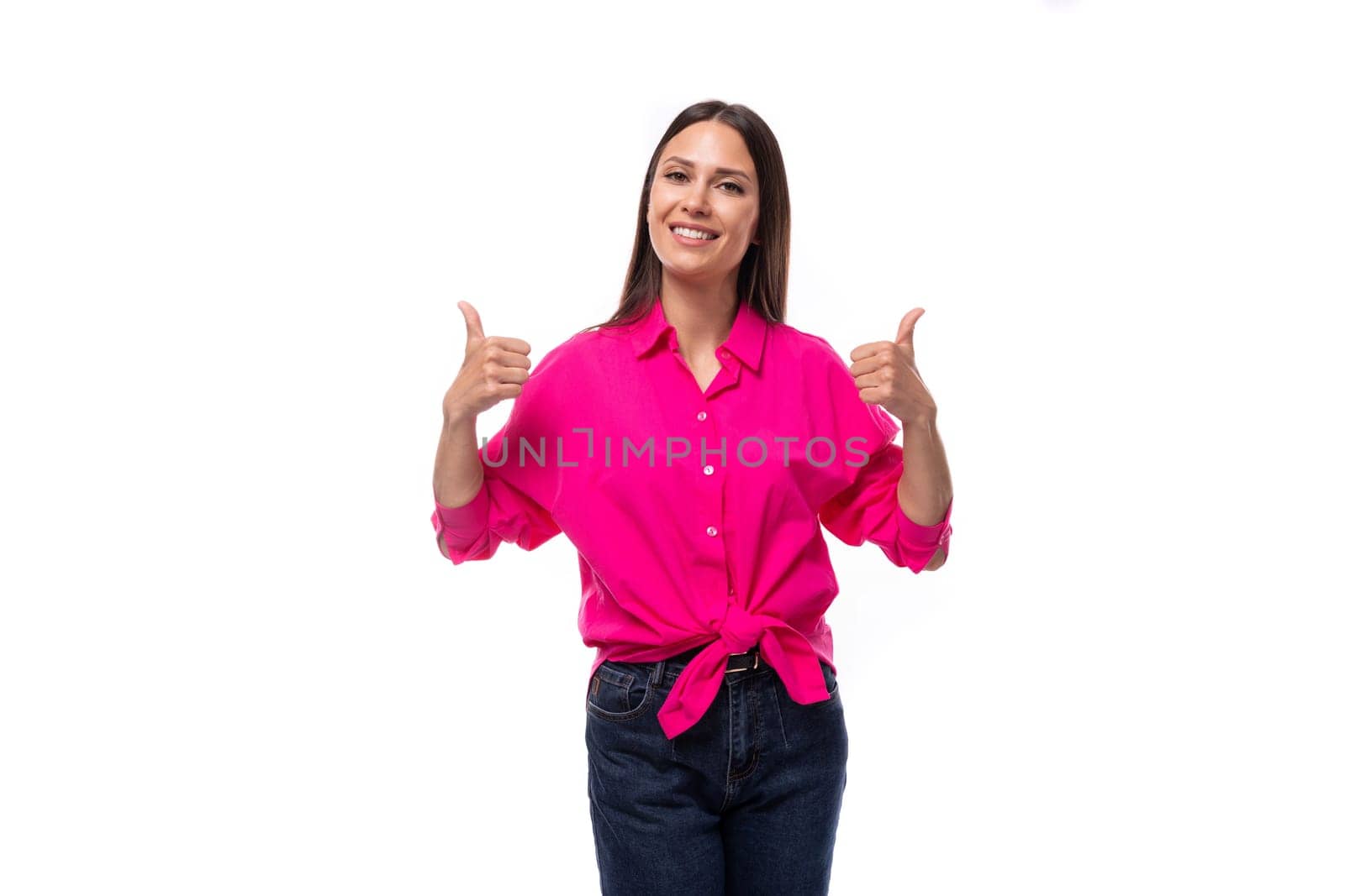 pretty young brunette businesswoman dressed in a pink shirt gesturing with her hands on a white background with copy space.