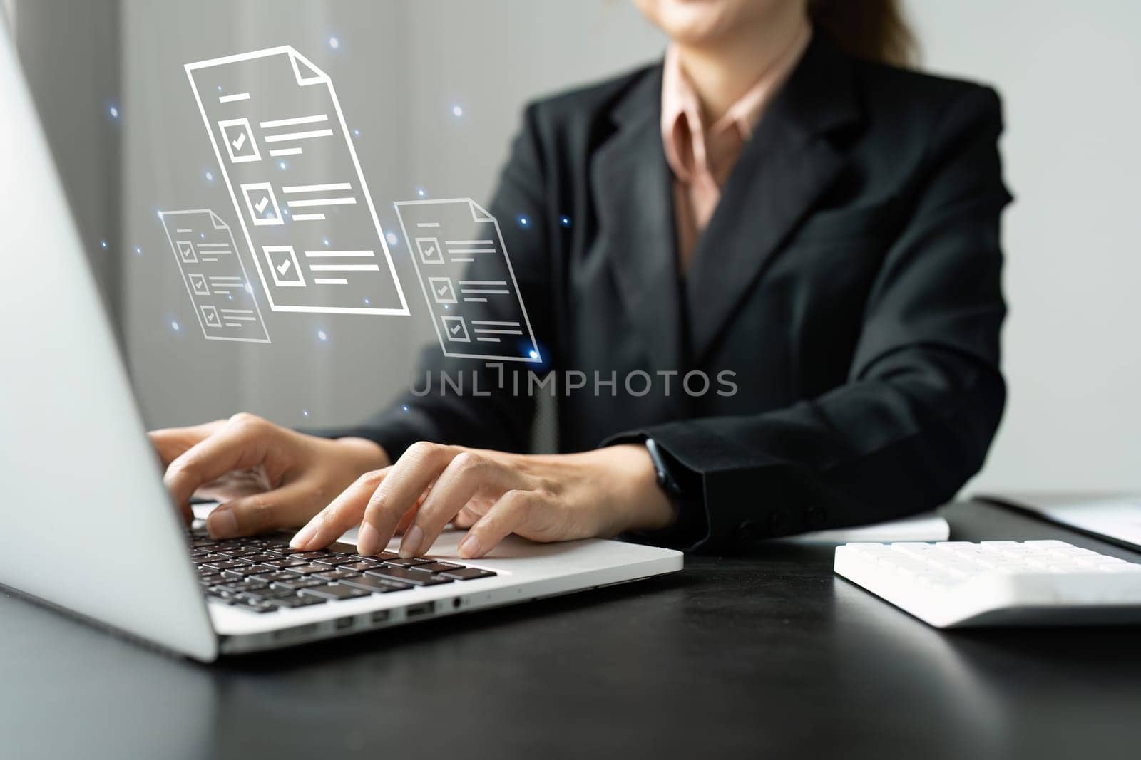 Businesswoman working on a laptop computer to document management online documentation database digital file storage system software records keeping database technology file access doc sharing.