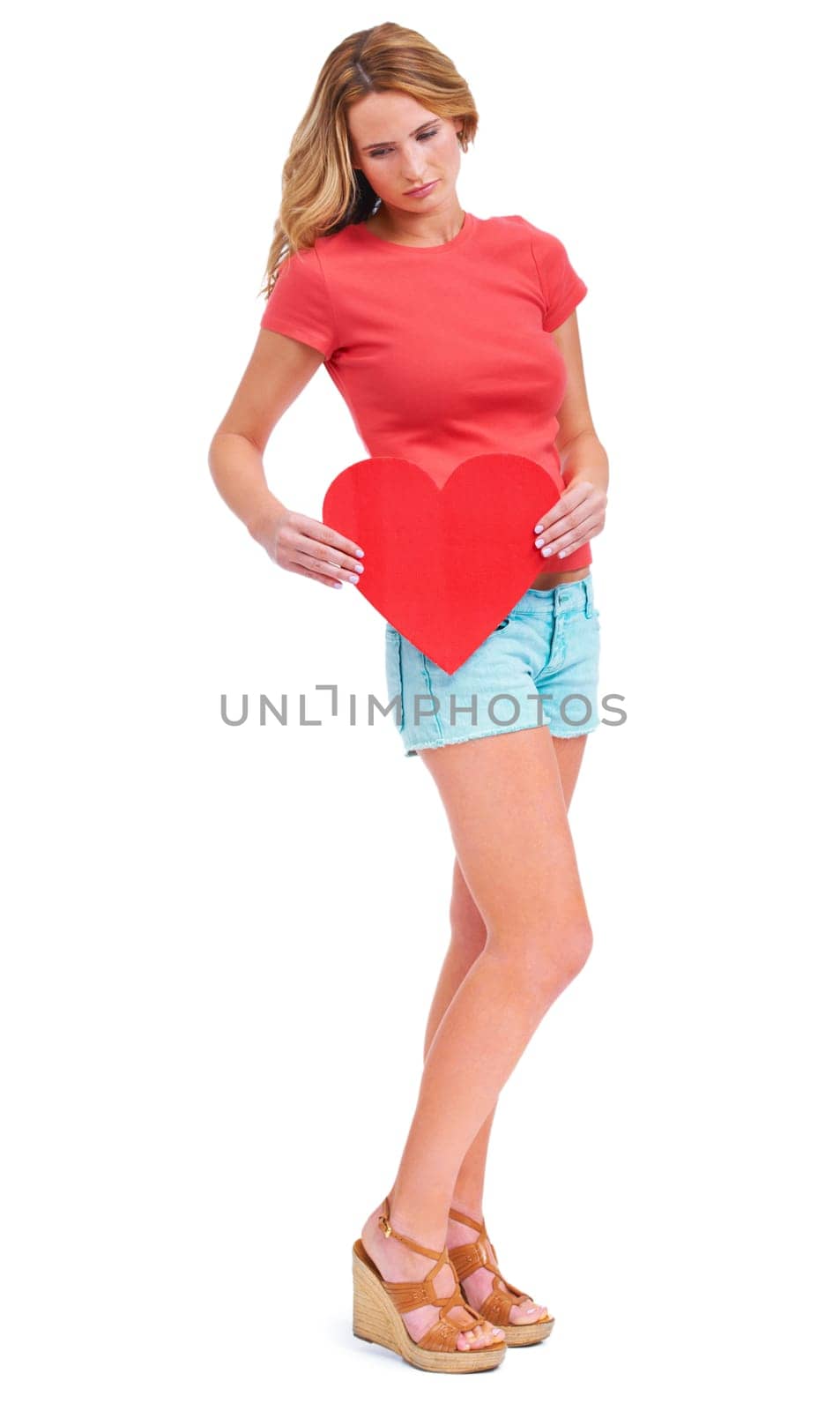 Woman, sad and valentines day heart in studio for relationship break up, romance fail or white background. Female person, unhappy and mockup space for love emoji icon, lonely symbol and depressed by YuriArcurs
