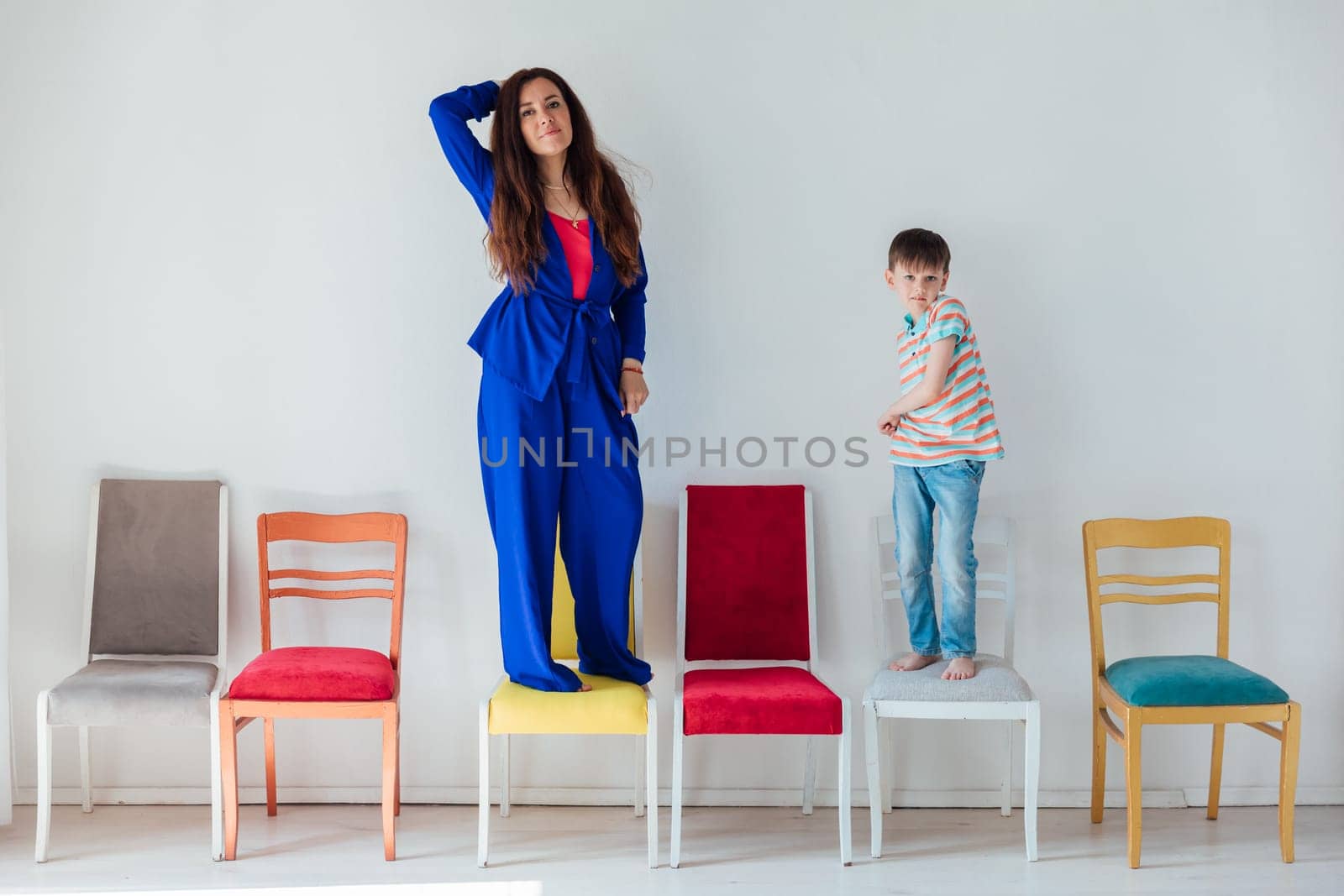 Woman with boy and many chairs