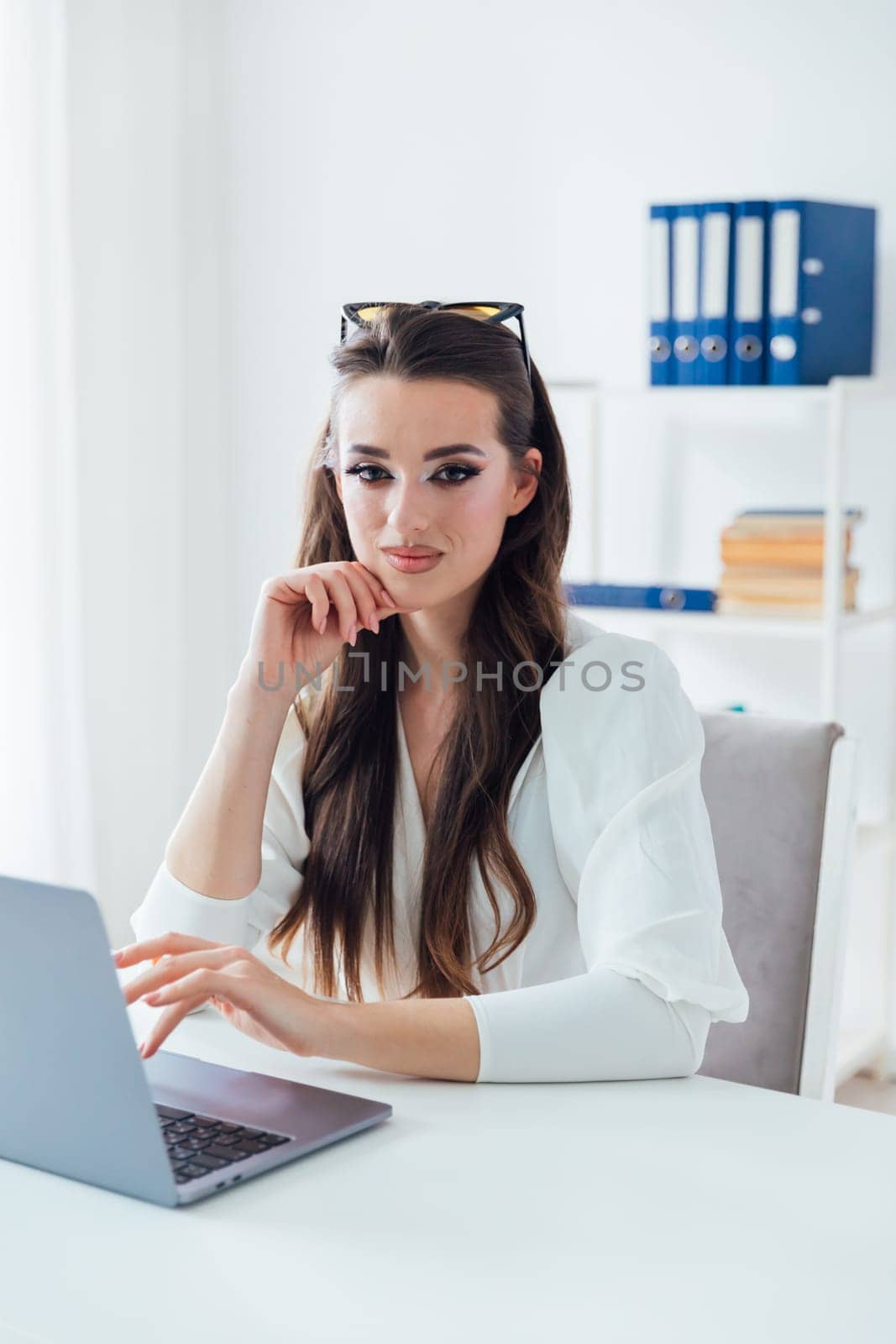 Business woman working on laptop in office finance business online