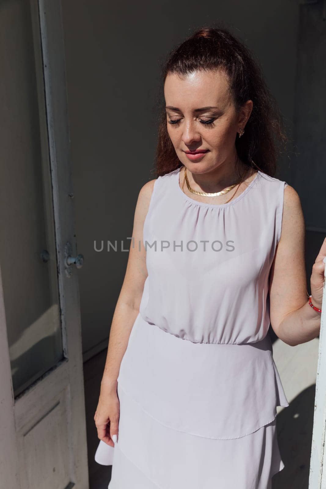 Brunette woman 40 years old in summer light dress by Simakov